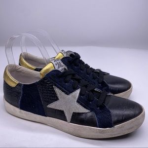 Meline Gold Star Black Leather Sneakers